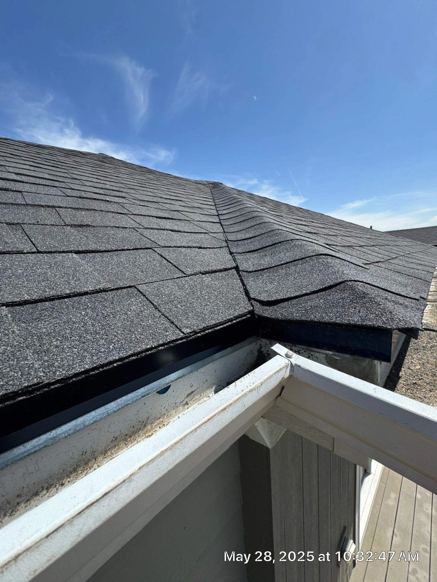 Clean new roofline against Colorado blue sky